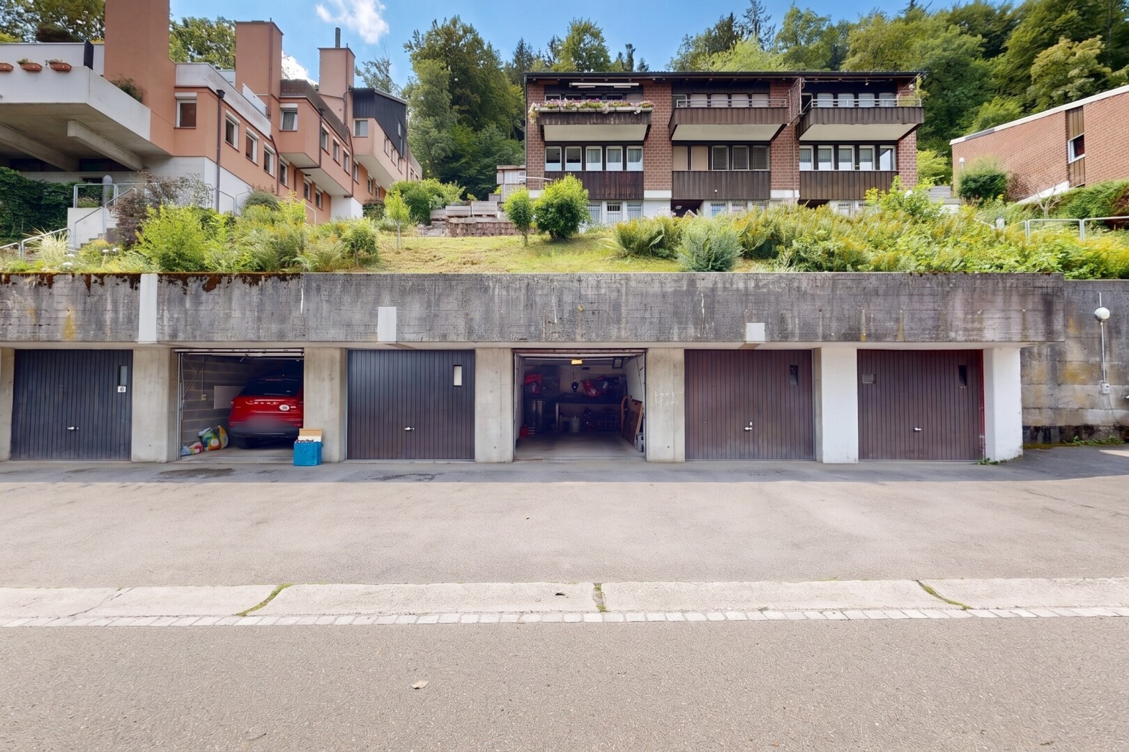 view of building exterior featuring community garages