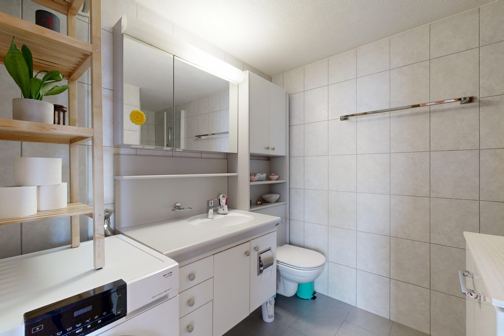 bathroom with tile walls, vanity, and dark tile patterned floors