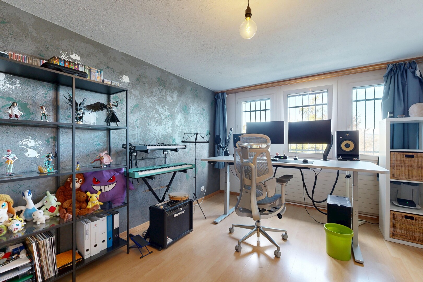 office area featuring light wood finished floors and decorative light fixtures