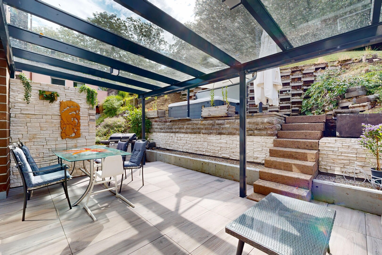 terrace featuring outdoor dining space and a patio area