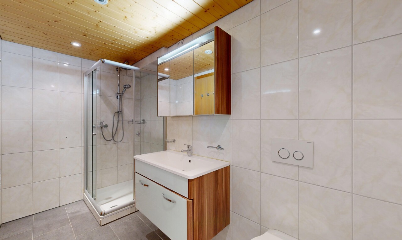 bathroom featuring tile walls, vanity, wood ceiling, a stall shower, and light tile patterned flooring