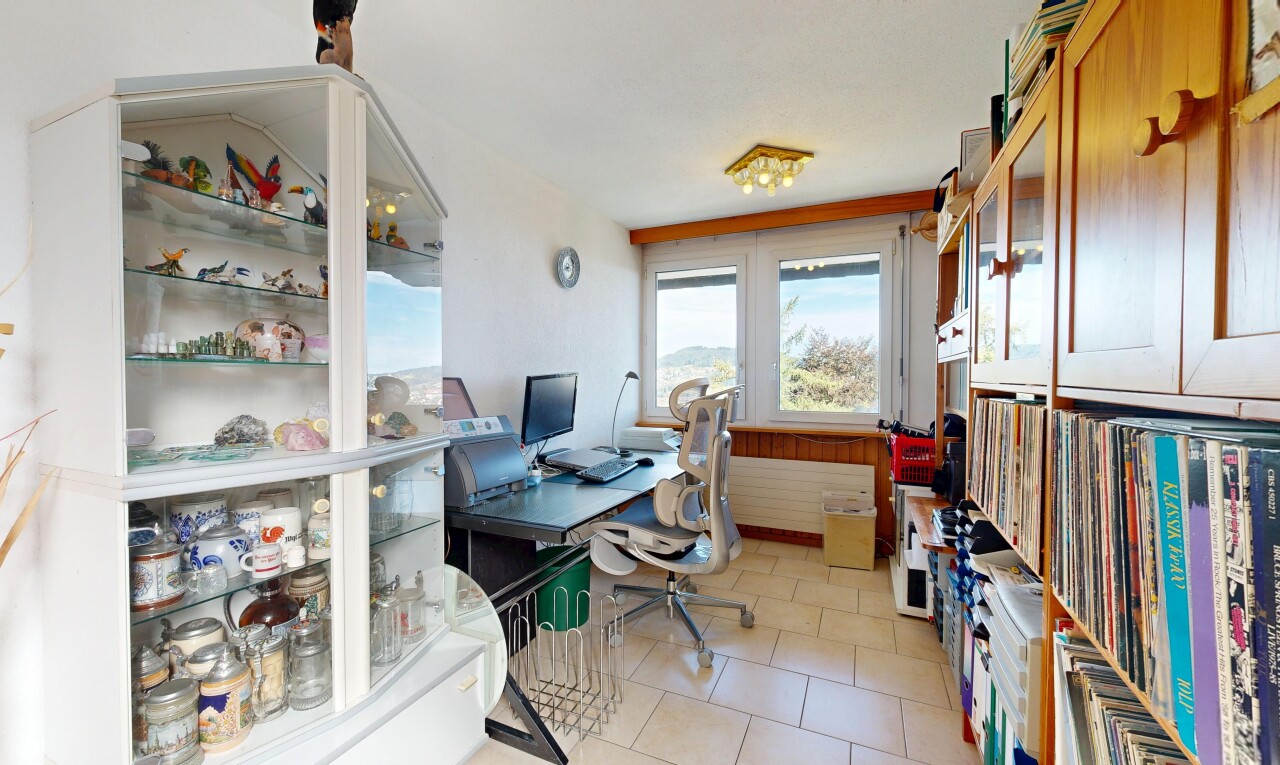 office area featuring light tile patterned floors and radiator heating unit