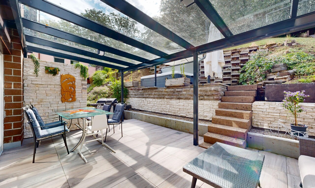 terrace featuring outdoor dining space and a patio area