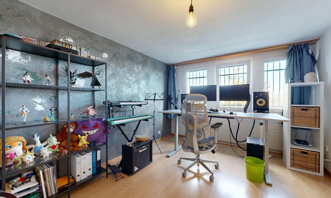 office area featuring light wood finished floors and decorative light fixtures