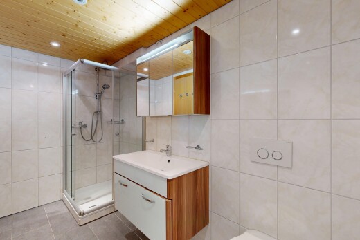 bathroom featuring tile walls, vanity, wood ceiling, a stall shower, and light tile patterned flooring