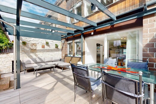 terrace with an outdoor living / dining area, a pergola, and a patio area
