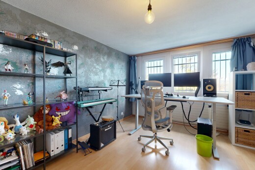 office area featuring light wood finished floors and decorative light fixtures