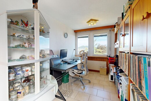 office area featuring light tile patterned floors and radiator heating unit