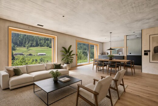 wohn- / esszimmer mit betondecke, concrete ceiling, holzfußboden, wood finish floor, und pendelleuchte