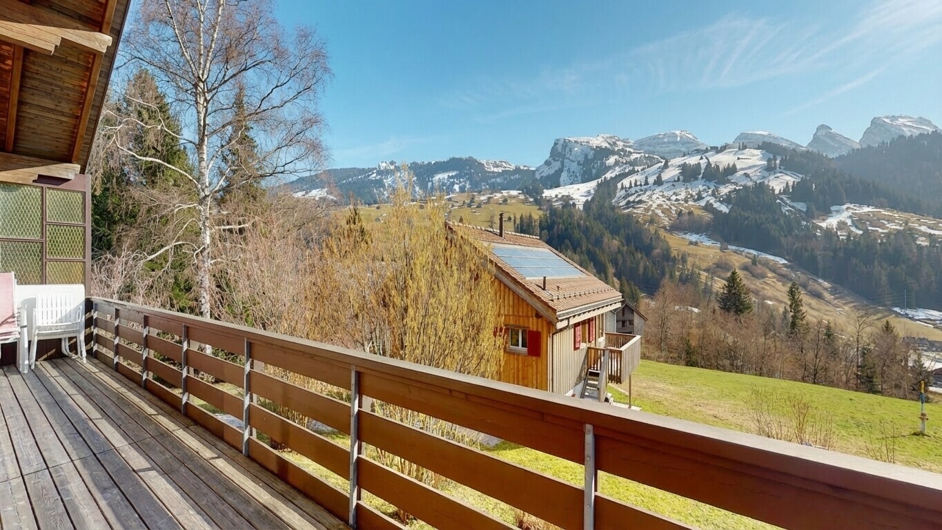 balcony with a mountain view and a view of rural / pastoral area