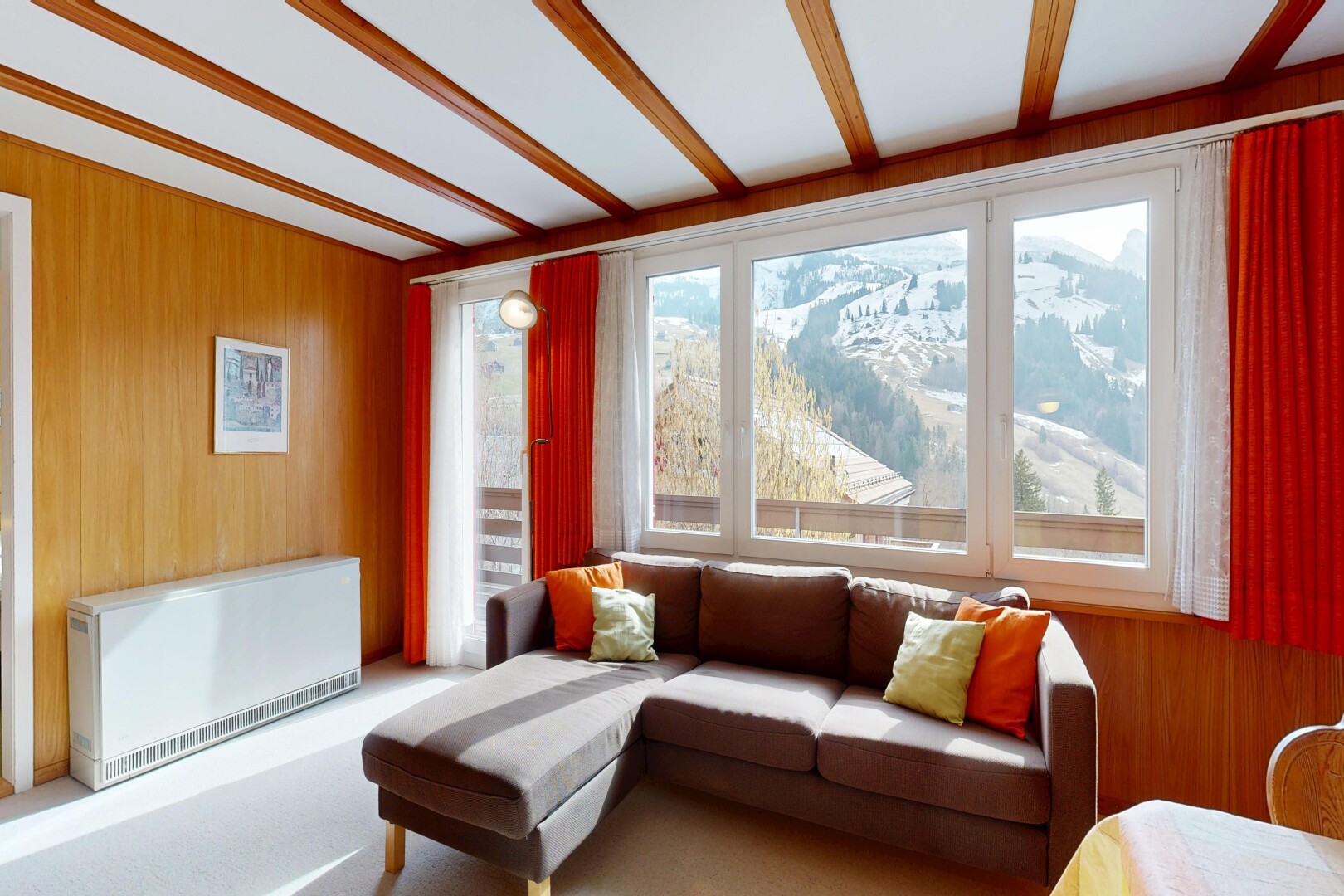 living area featuring wooden walls, heating unit, and radiator heating unit