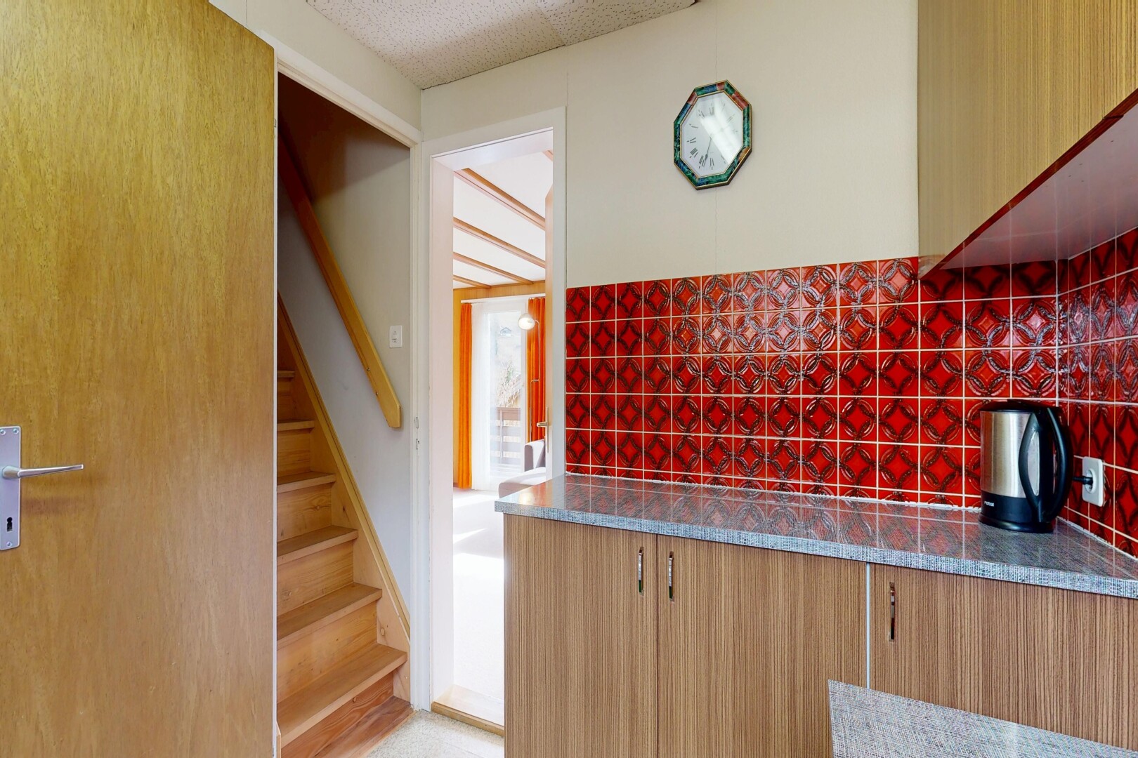 kitchen with dark stone counters and decorative backsplash