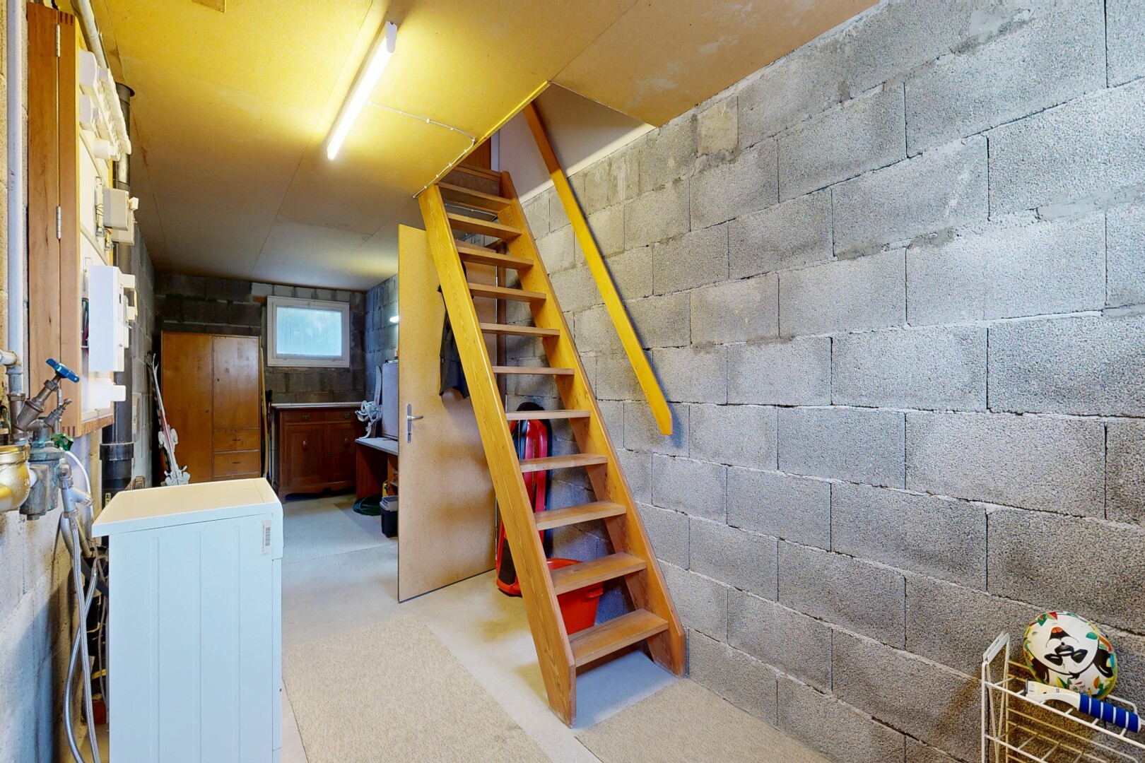 staircase with washer / dryer