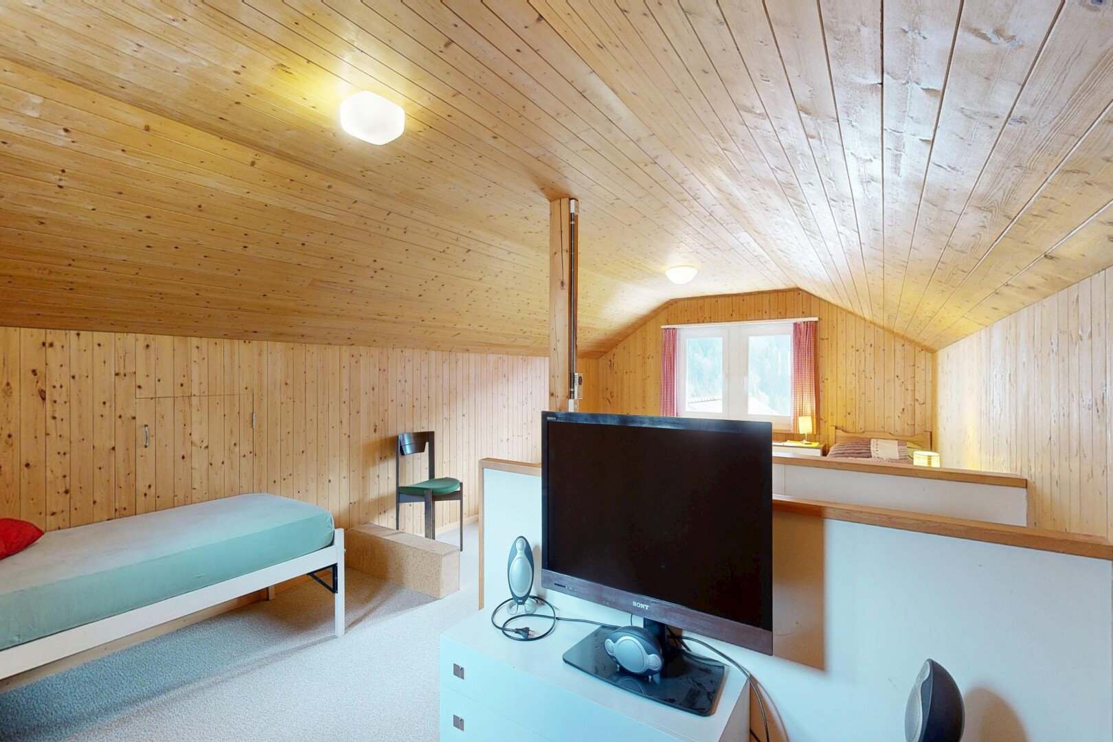 room / bedroom with wooden walls, a vaulted wood ceiling, and an office area