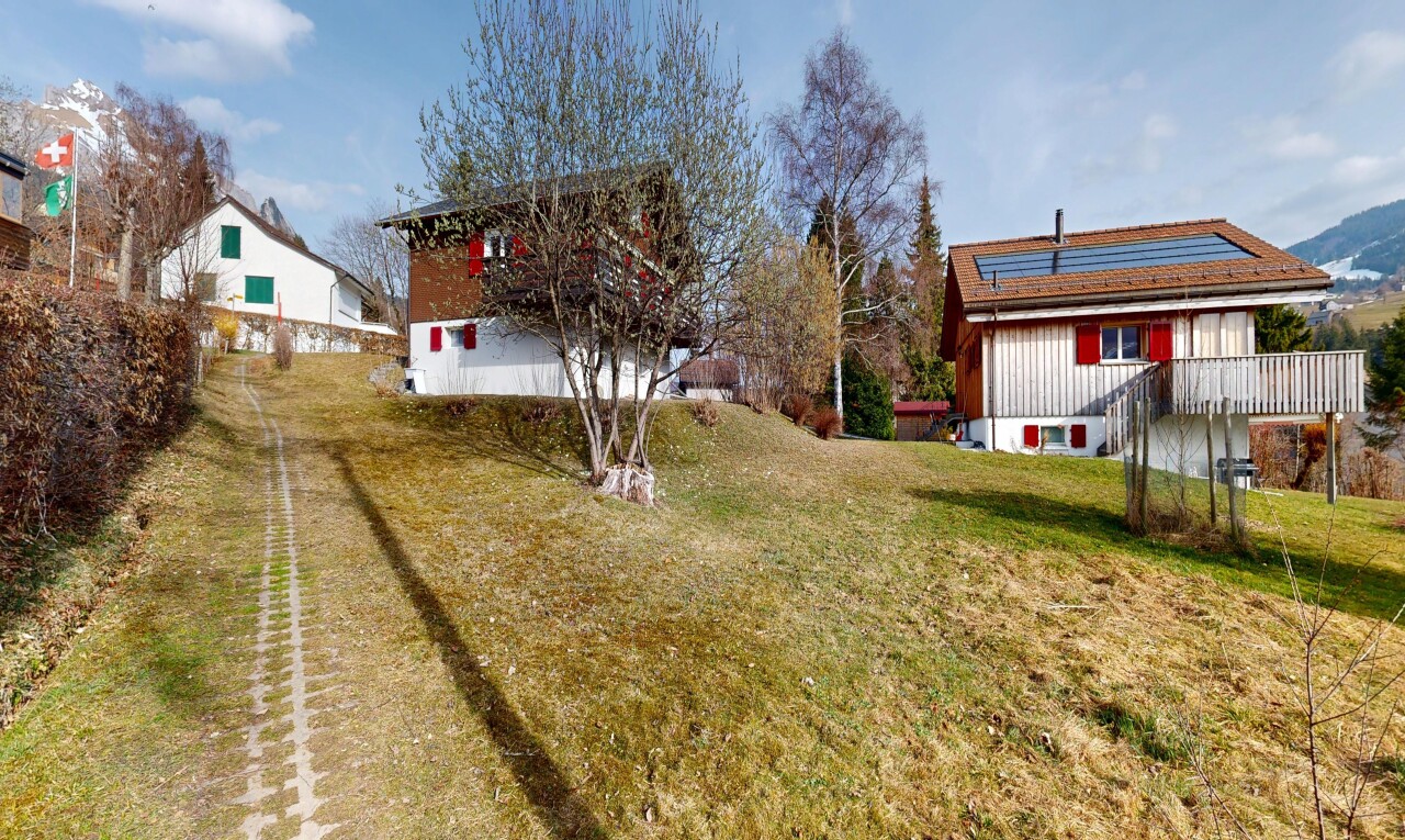 view of property featuring a yard
