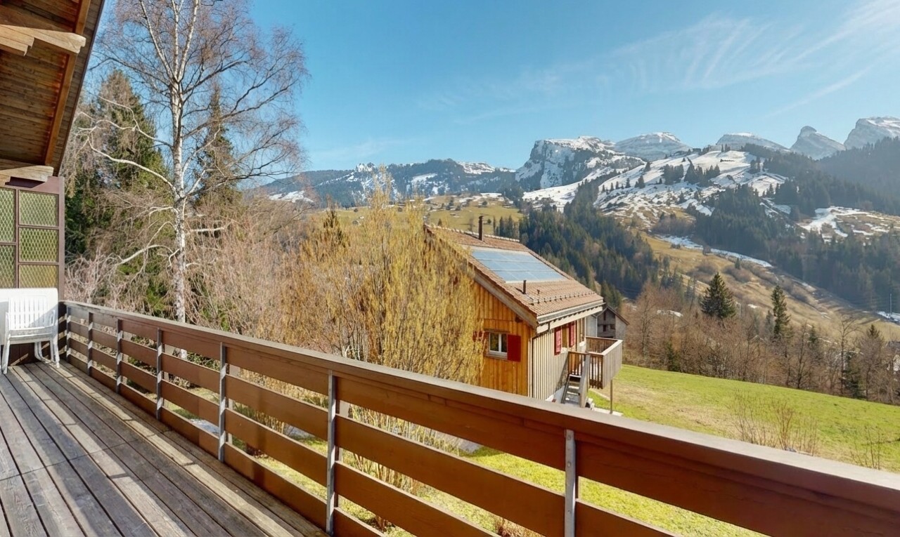 balcony with a mountain view and a view of rural / pastoral area