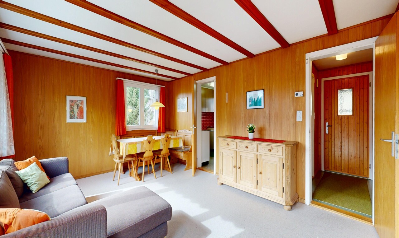 living area featuring light colored carpet