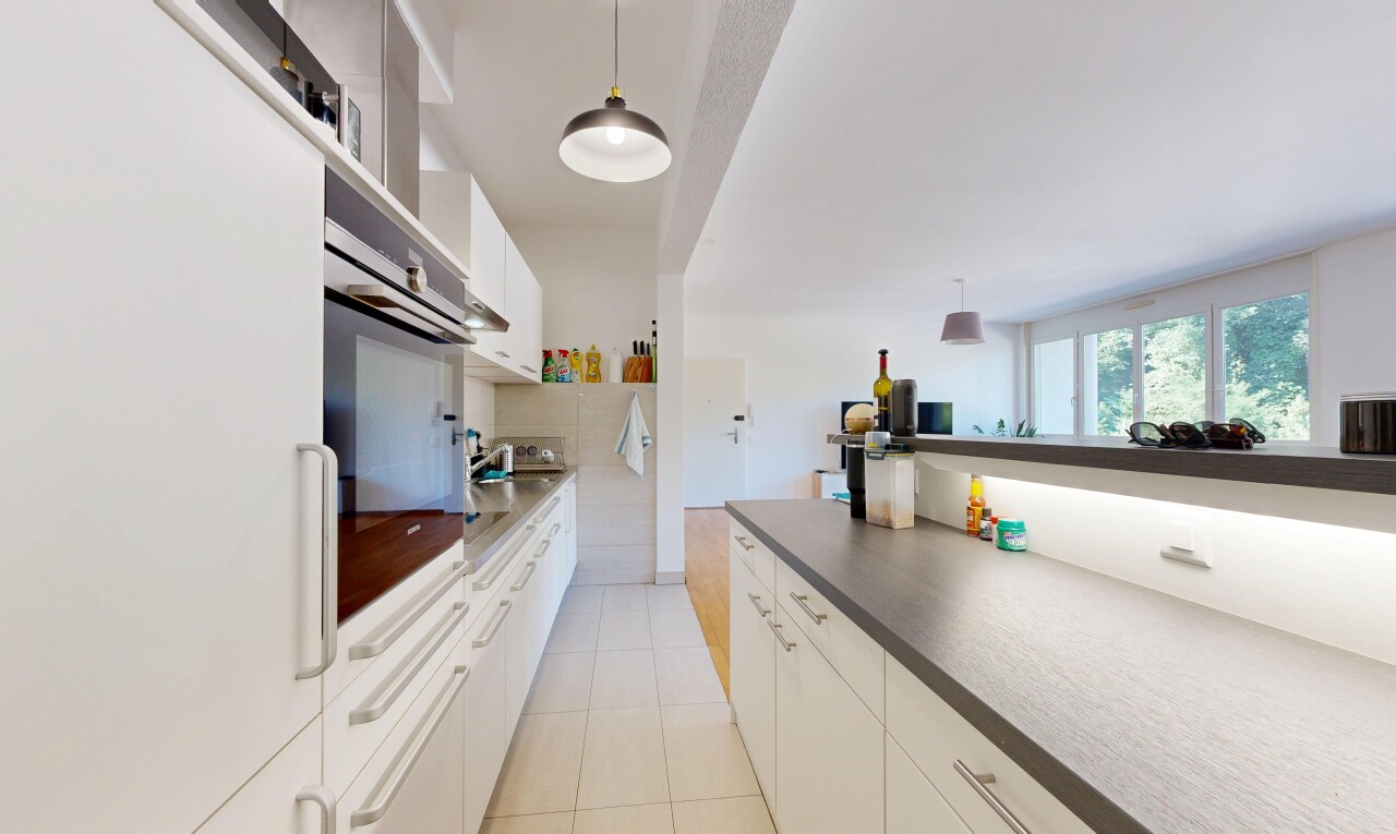 kitchen featuring white cabinetry, white refrigerator, decorative light fixtures, stainless steel oven, and dark countertops