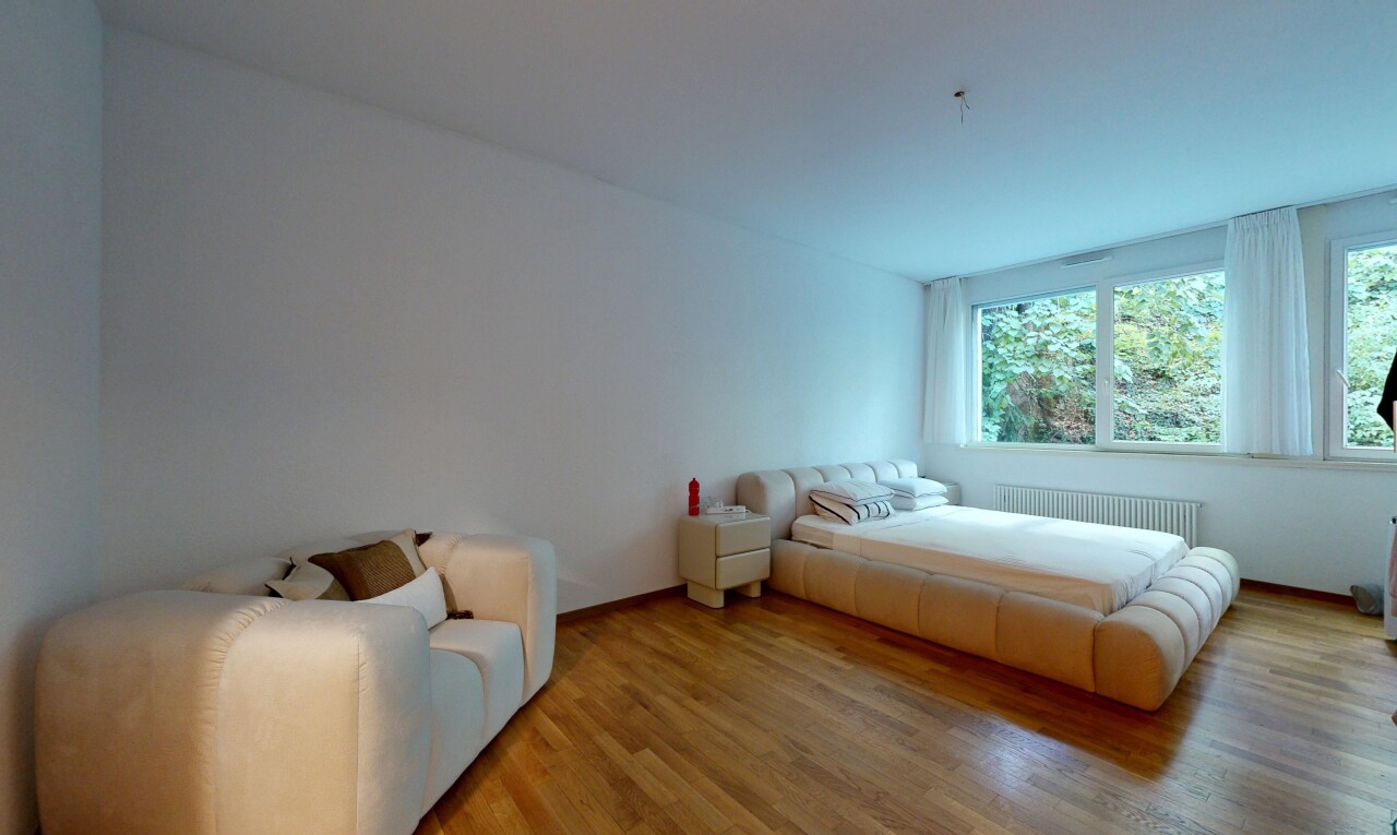 room / bedroom featuring wood finished floors and radiator