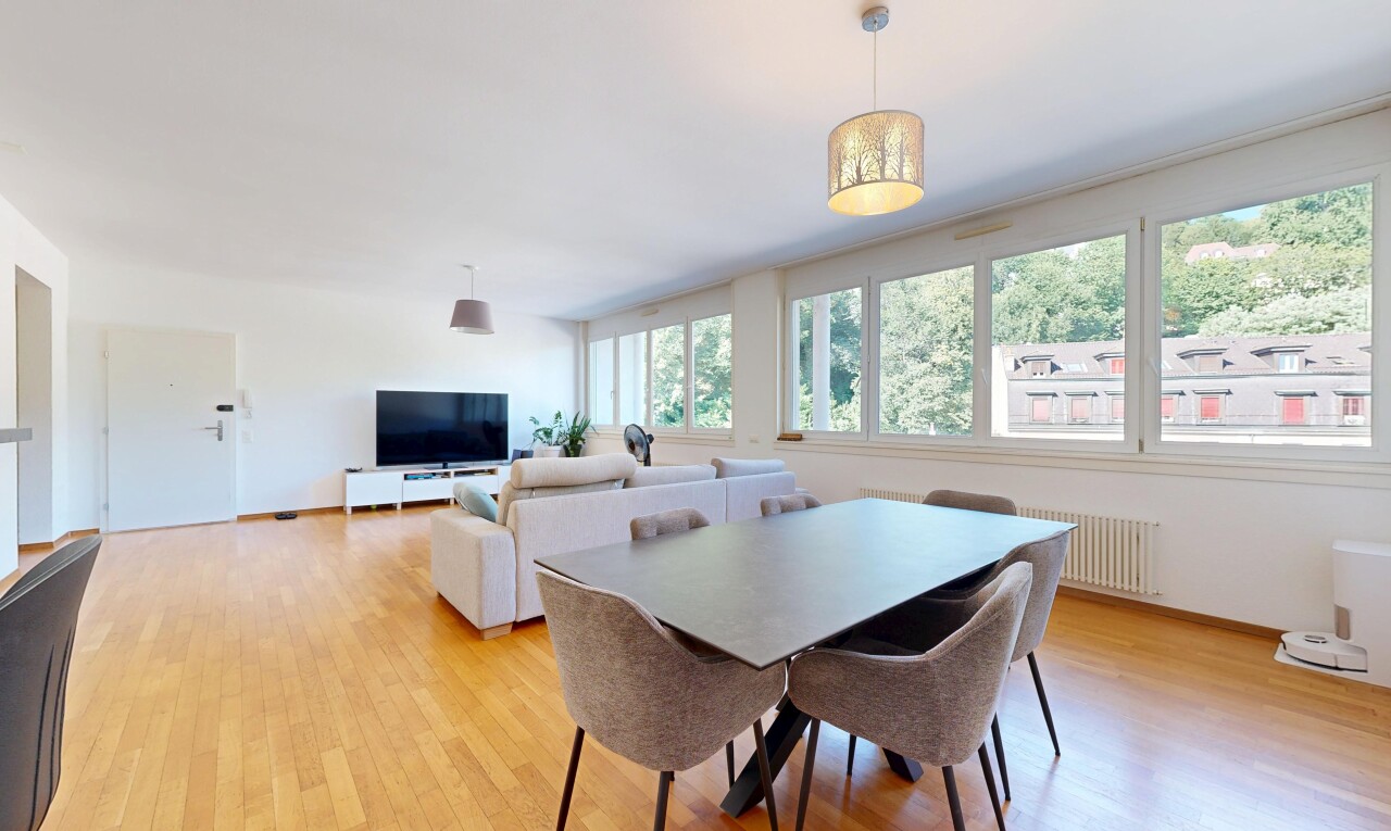 living room with light wood-type flooring and radiator