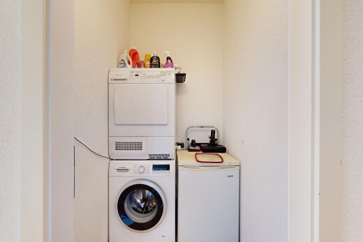 laundry room featuring stacked washer / dryer