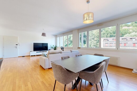 living room with light wood-type flooring and radiator