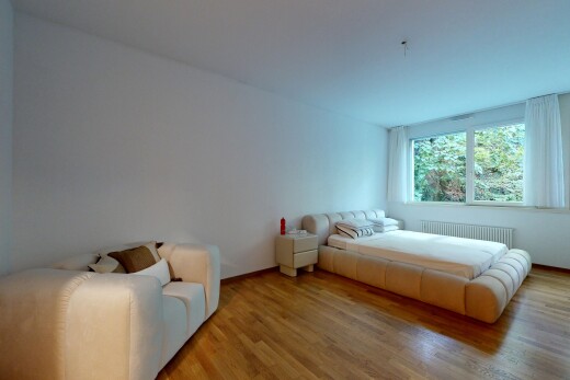 room / bedroom featuring wood finished floors and radiator