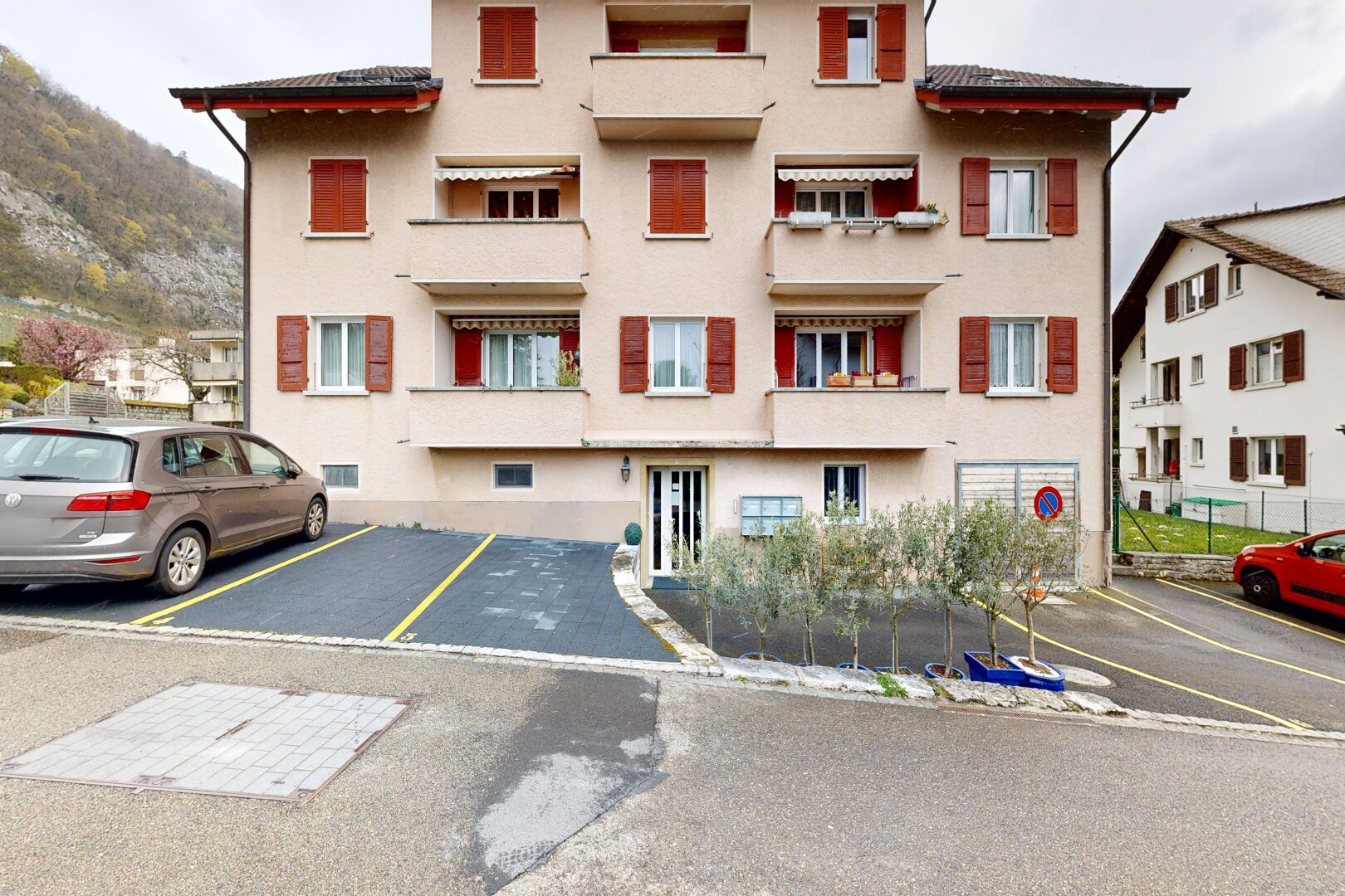 view of property featuring uncovered parking