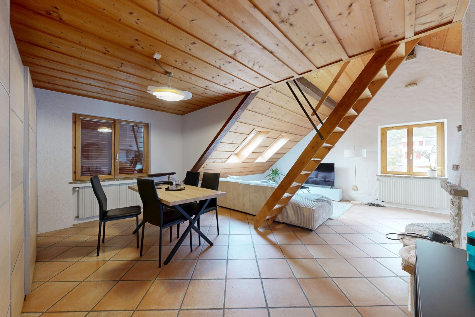 living room featuring radiator heating unit, a vaulted wood ceiling, and light tile patterned flooring