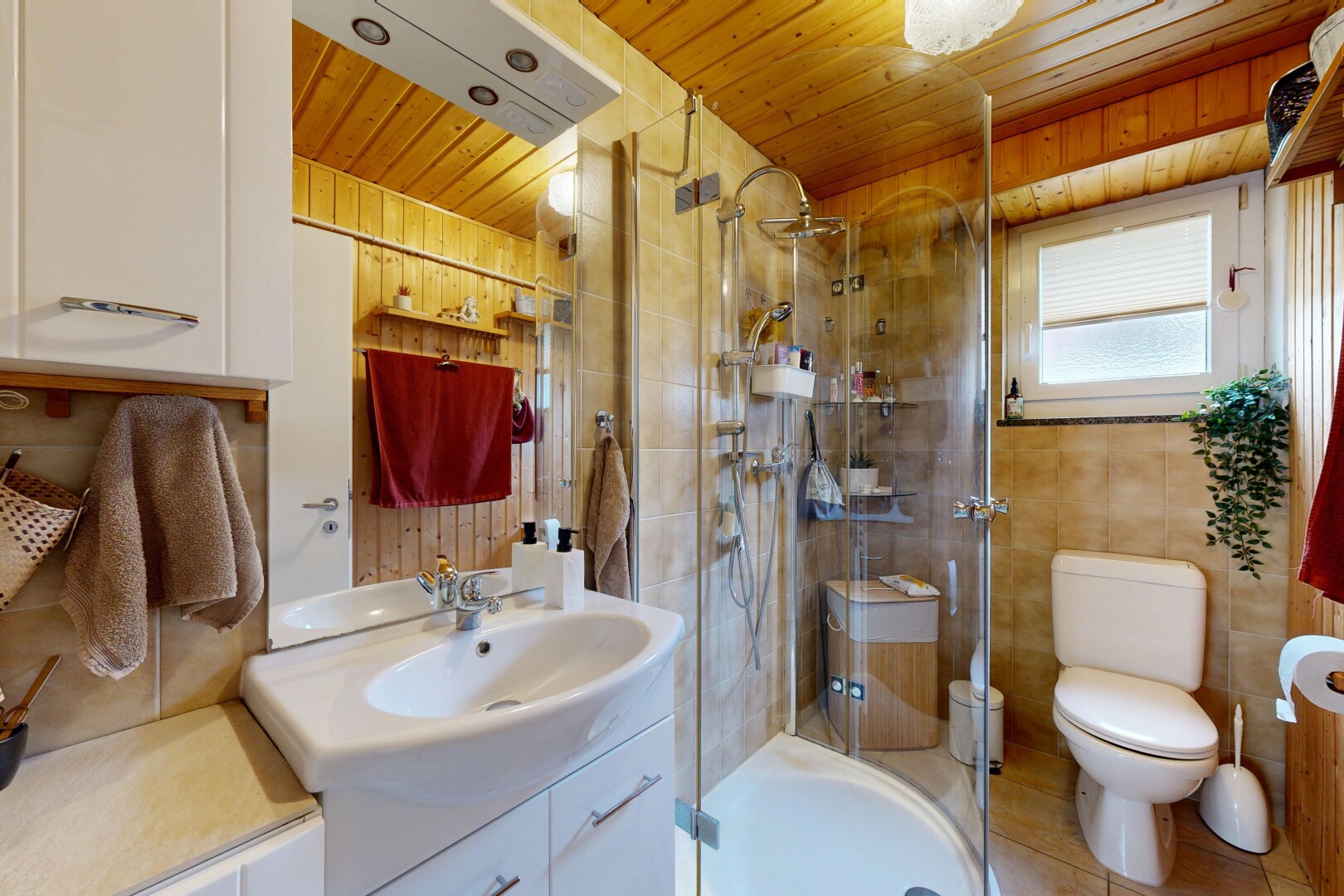 bathroom with vanity, a shower stall, and wooden ceiling