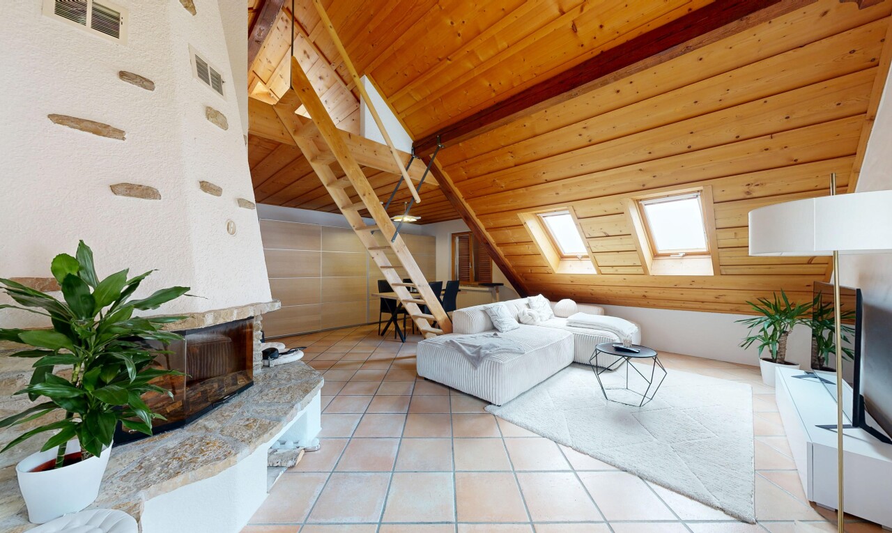 living area with a skylight, a high end fireplace, lofted ceiling with beams, light tile patterned flooring, and wooden ceiling