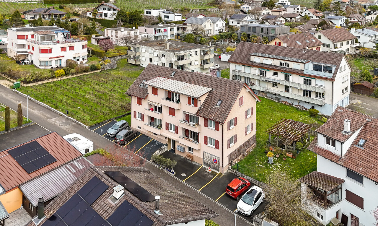 view of home featuring uncovered parking