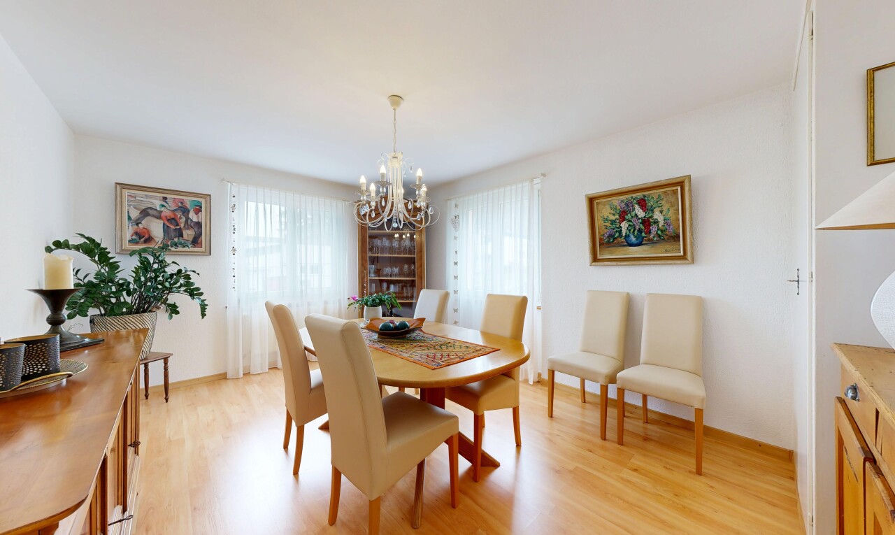 dining room featuring light wood-type flooring, plenty of natural light, and hanging lights