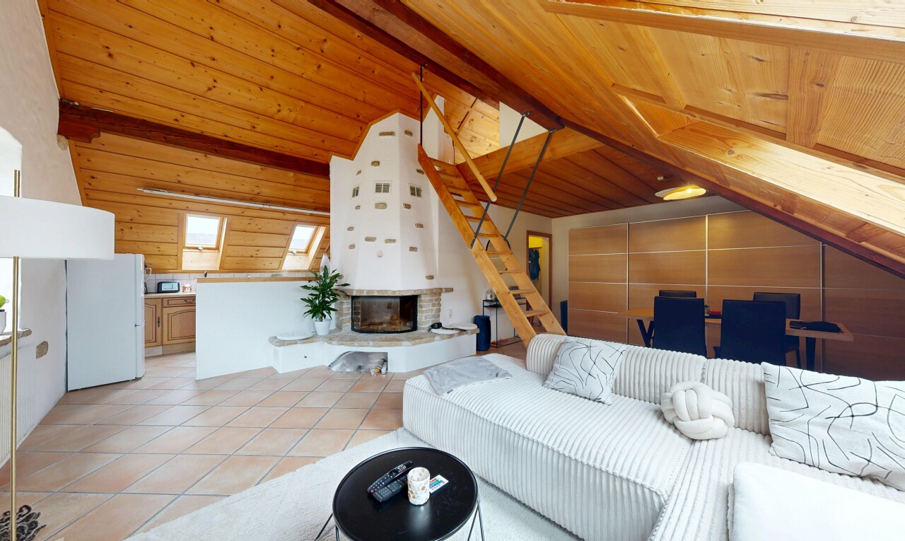 living room featuring a glass covered fireplace, light tile patterned flooring, wooden ceiling, wood walls, and a skylight