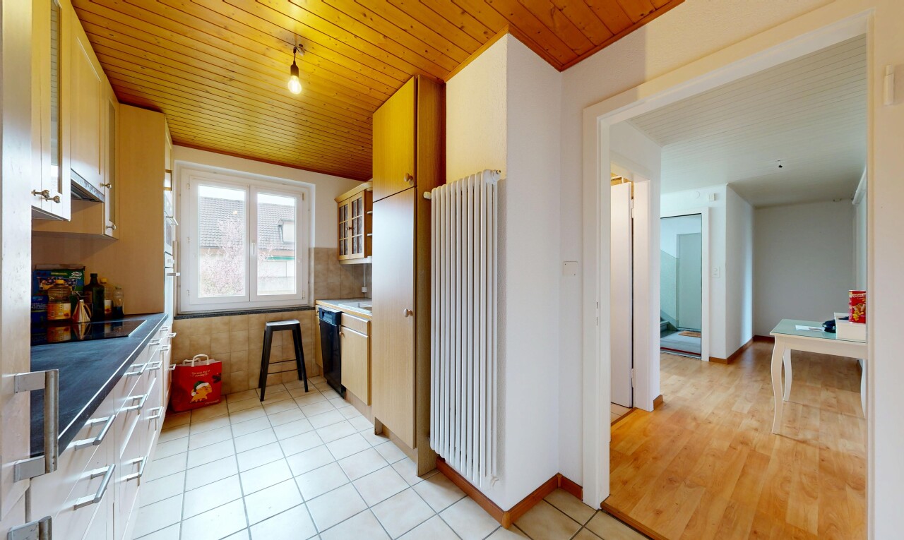 kitchen with radiator, wooden ceiling, glass insert cabinets, light tile patterned floors, and black electric stovetop