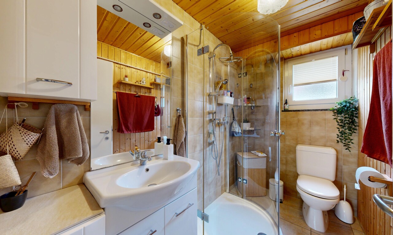 bathroom with vanity, a shower stall, and wooden ceiling