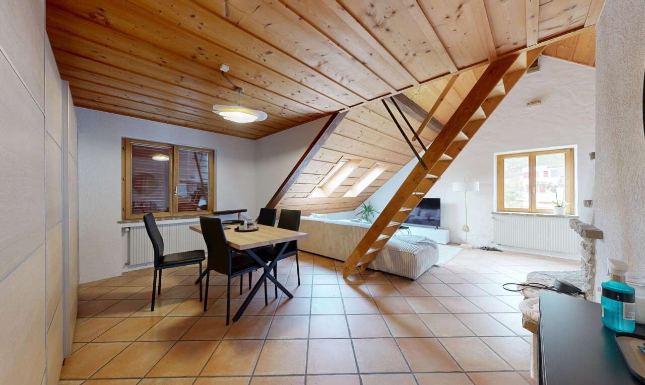 living room featuring radiator heating unit, a vaulted wood ceiling, and light tile patterned flooring