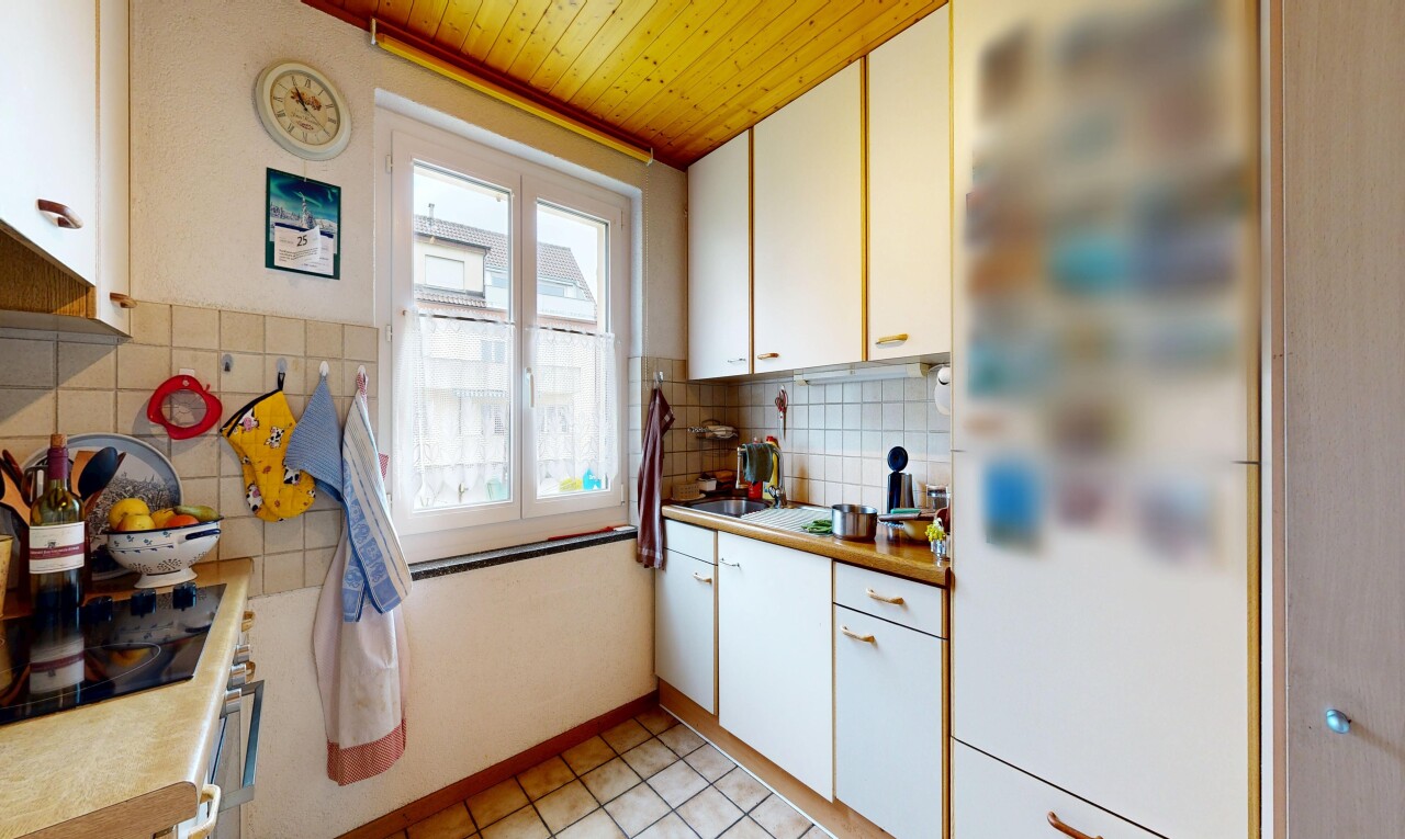 kitchen with white cabinets, light countertops, wooden ceiling, and light tile patterned floors