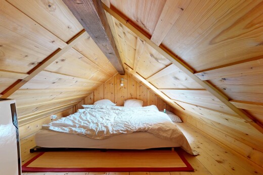 room featuring wooden ceiling, wood walls, and light wood-style flooring