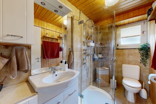 bathroom with vanity, a shower stall, and wooden ceiling