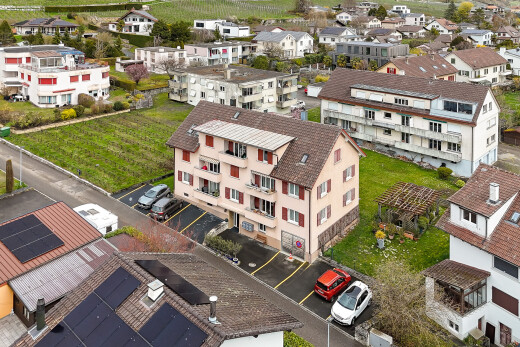 view of home featuring uncovered parking