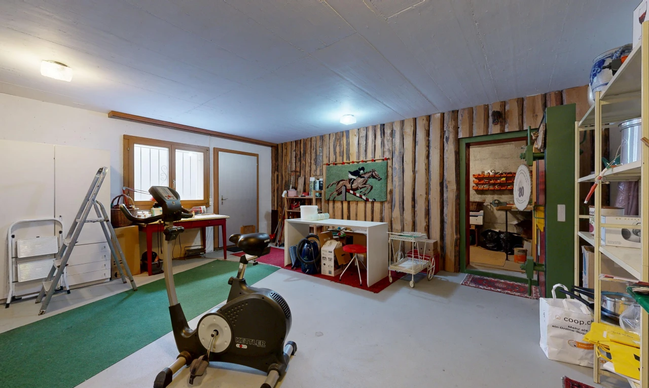 workout area featuring wooden walls and concrete flooring
