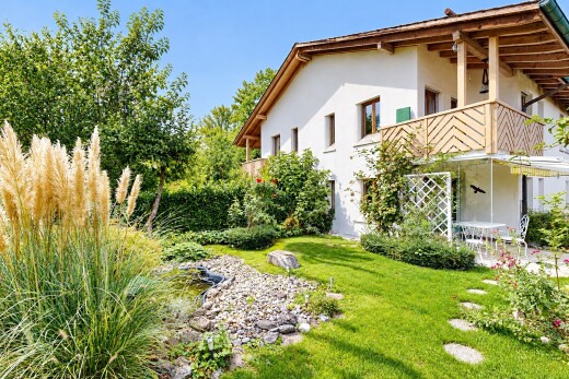 garden featuring a balcony and a yard
