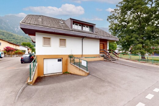 view of home with stucco siding and a garage