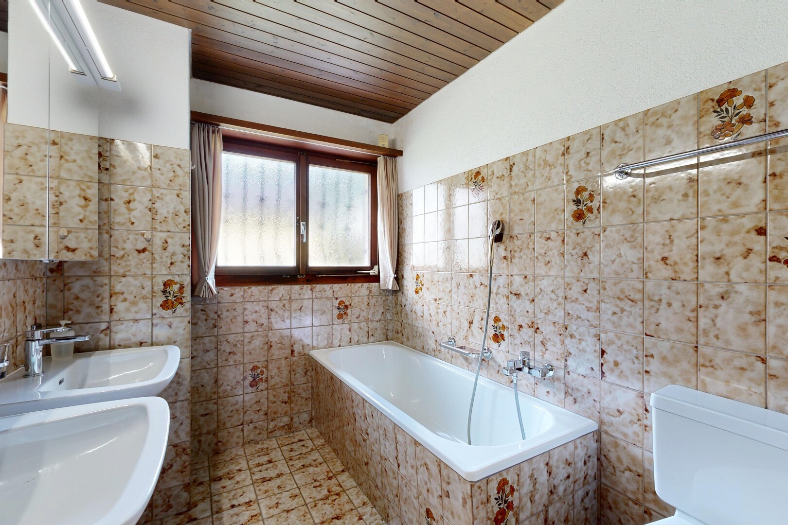 bathroom with a garden tub, wood ceiling, and tile walls