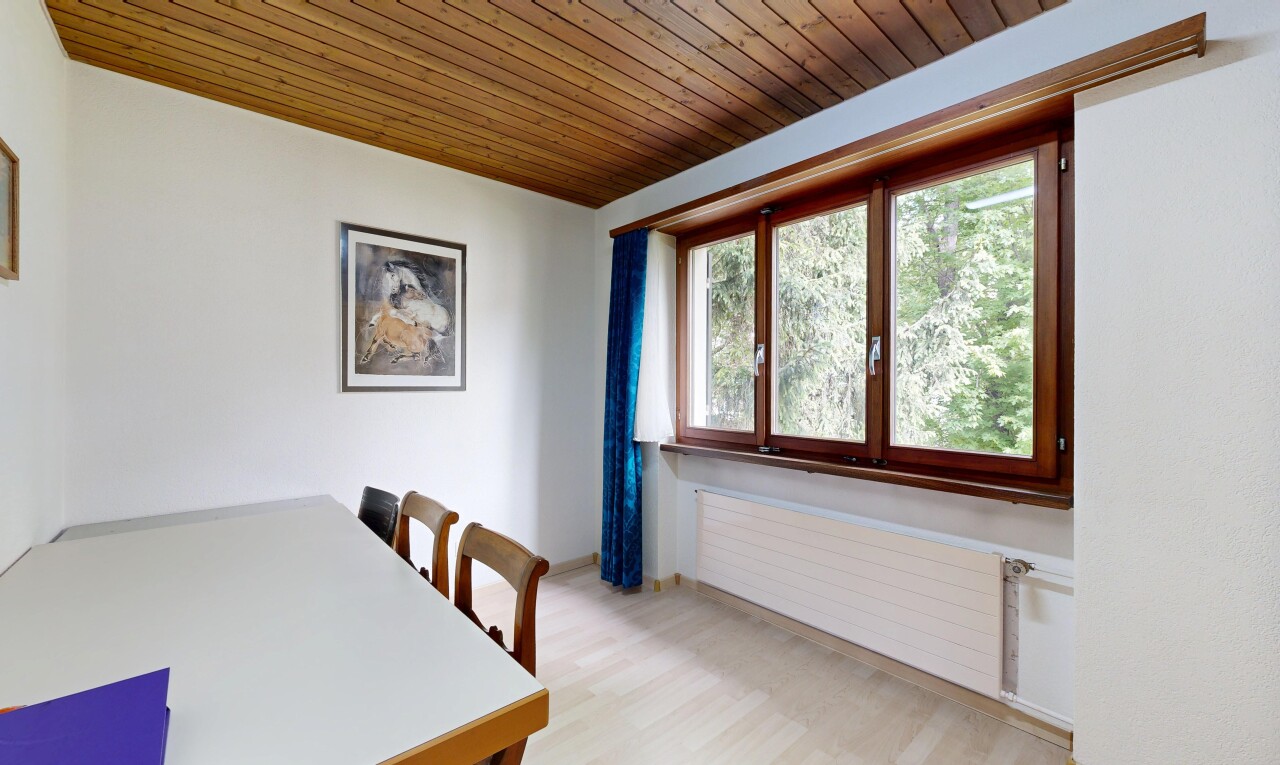 dining room featuring wooden ceiling, radiator heating unit, and light wood finished floors