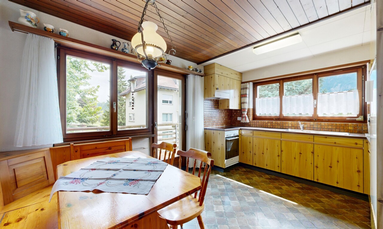 kitchen featuring wooden ceiling, tasteful backsplash, oven, pendant lighting, and light countertops
