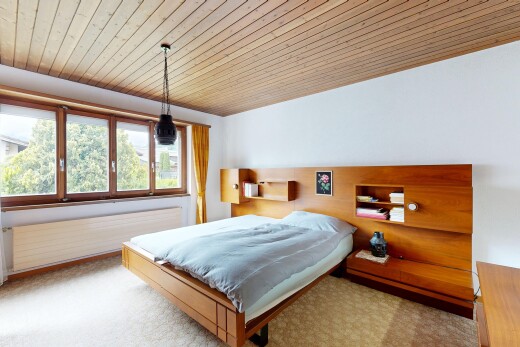 room / bedroom with wood ceiling and light colored carpet