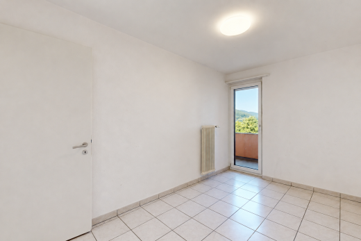spare room featuring radiator heating unit and baseboards
