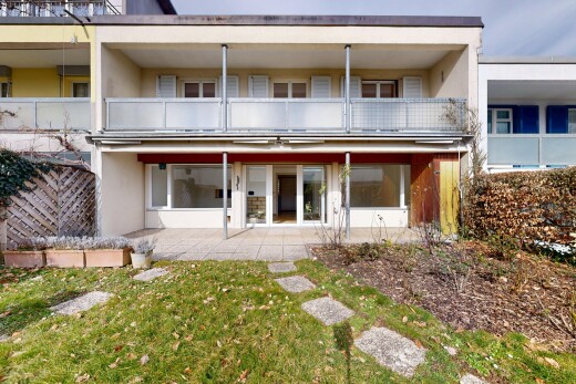 außenansicht mit rasen, terrasse, stuckverkleidung, und balkon